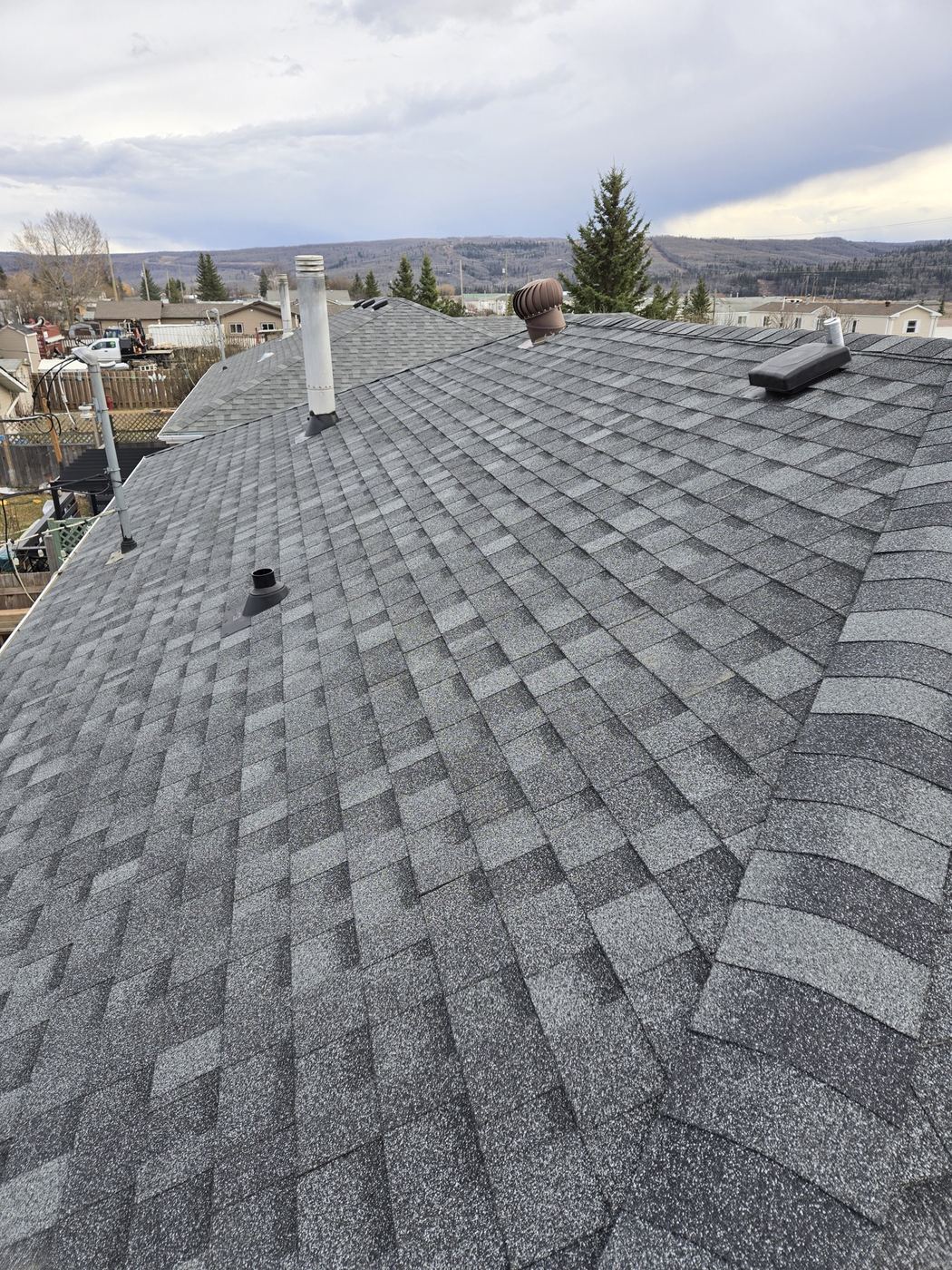 Close-up of new architectural shingles and ridge cap · Sunnybrook Roofing